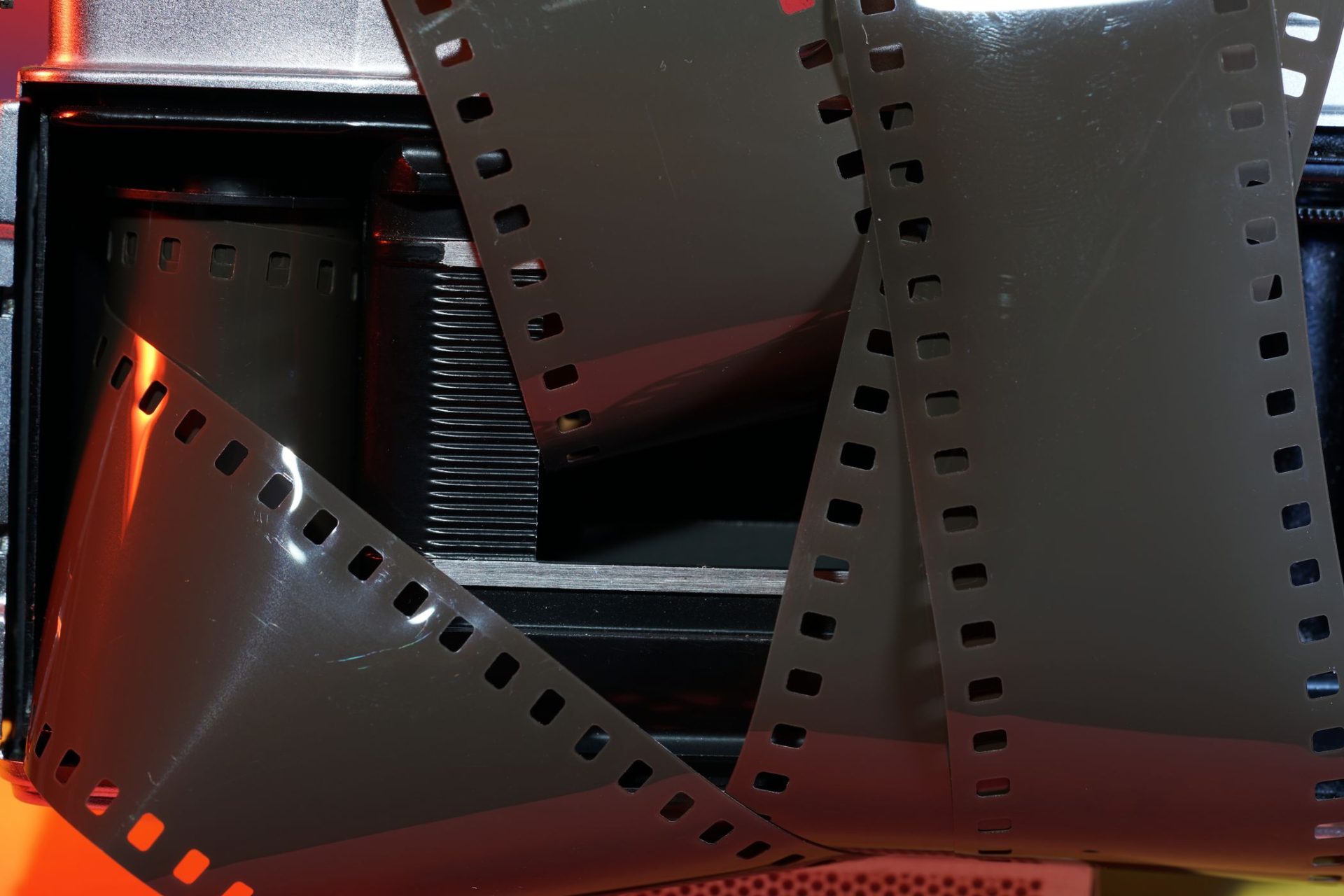 closeup-shot-of-an-old-film-camera-with-film-strip-2023-11-27-05-04-45-utc Super 8mm Short Films